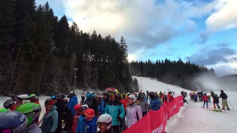 Ski lift Crowds queue at winter sport resort showing leisure lifestyle Stock Footage 327408210