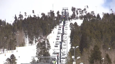 Ski Lift going up Mountain through Trees in Colorado Stock Footage 93376840