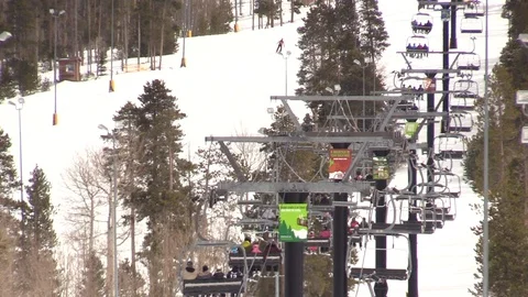 Ski Lift going up Mountain through Trees in Colorado Stock Footage 93401826