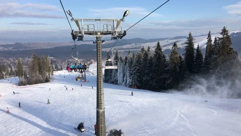 Ski lift with people on it Stock Footage 87190271