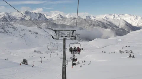 Ski lift with the pyrenees in the background Video stock 46865331