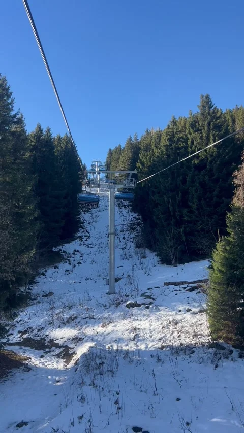 Ski lifts going up and down in Meribel ski resort, French alps, France Stock Footage 334404002