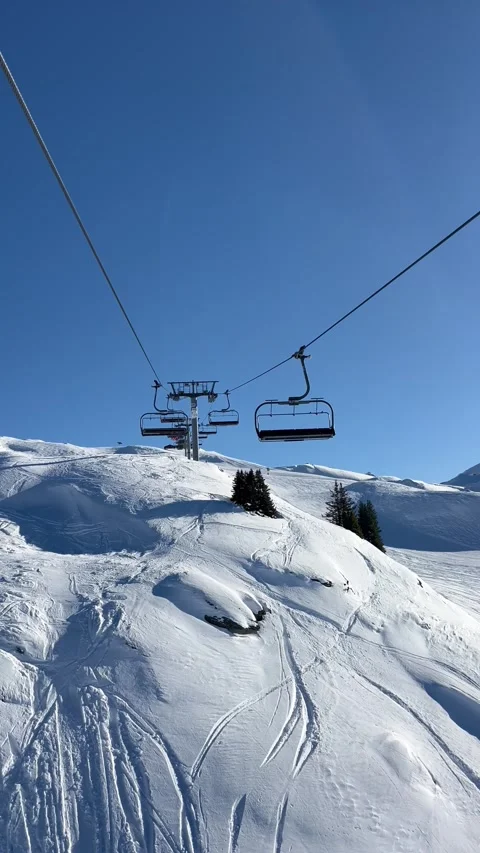 Ski lifts going up and down in Courchevel ski resort, French alps Stock Footage 336965038