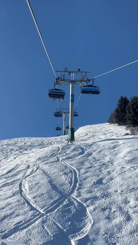 Ski lifts going up and down in Meribel ski resort, French alps, France Stock Footage 341427700