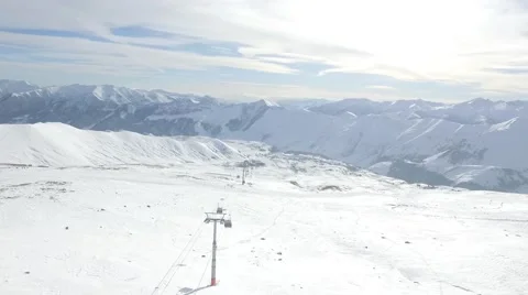 Ski lifts moving through snow-covered winter forest, bottom view Stock Footage 58336559