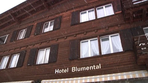 SKI LODGE WITH SNOW FALLING Stock Footage 121850749