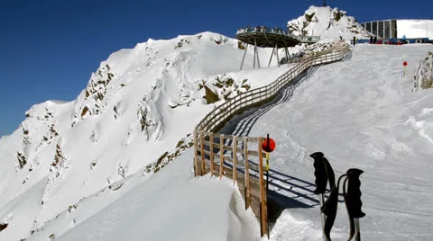 Ski poles on top of steep mountainside Stock-Footage 24748698