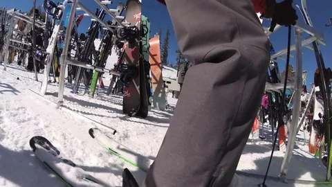 Ski racks full of skis and snowboards at a ski resort. Stock Footage