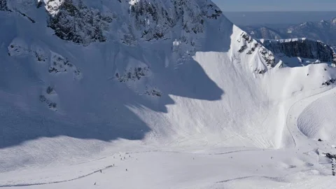 Ski resort area with extensive snowfields and dramatic ridgelines Video stock 328306789