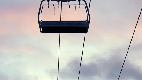 Ski resort with empty alpine skiing tracks and stopped ski lift. Stock Footage 145333200