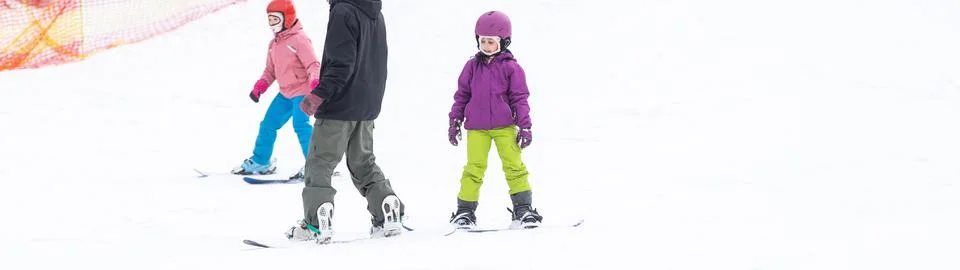 Ski Resort Father Teaching Little Daughter Snowboarding Stock Photos