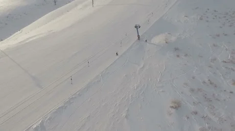 Ski resort. Flying along the running ski lift. Stock Footage 59591898