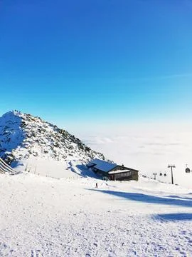 Ski resort. Mountain peak in the clouds Stock Photos
