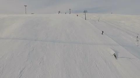 Ski resort. Skiers descend near the ski lift. Stock Footage 59591130