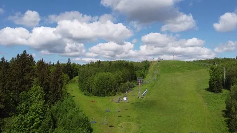Ski resort in summer beautiful clouds over the mountain slope Stock Footage 145613459