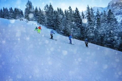 Ski school for children class during snowfall Stock Photos