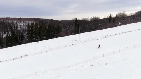 Ski school. The instructor teaches the child to ski. Aerial view 動画素材 148423759