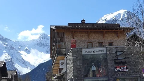 SKI SHOP WITH MOUNTAIN BACKGROUND Stock Footage 121450493