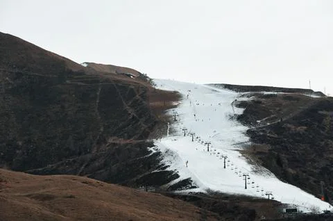 Ski slope with artificial snow only Stock Photos