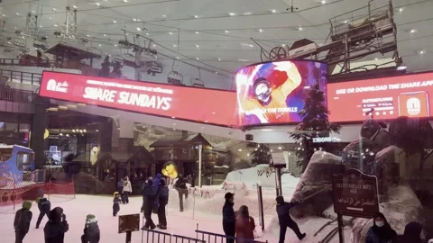 Ski Slope Visitors Beneath Large LED Screens, United Arab Emirates 4K HDR 60fps Stock Footage 164930183