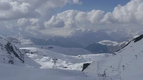 Ski slopes arranged in high mountains with grows cliffs where plenty of athl Stock Footage 171062789
