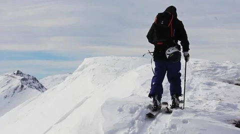 Ski touring on mountain peak Stock Footage 49007199