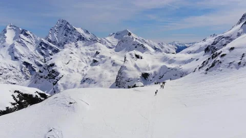 Ski Touring people skiing down the mountain valley. Epic free ride scene. Stock Footage 150679616