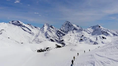 Ski Touring people skiing down the mountain valley. Epic free ride scene. Stock Footage 150680265