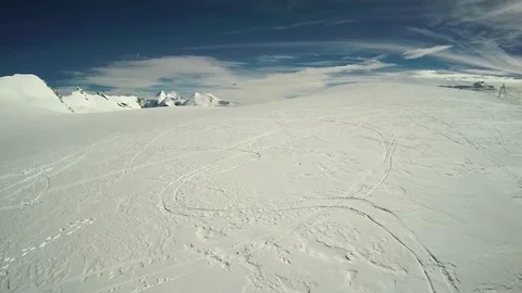 Ski tracks on the snow covered mountain slope Stock Footage 77808977