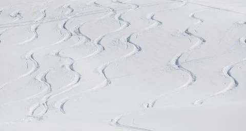 Ski tracks on the white snowy mountain. Stock Photos