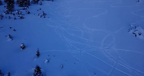 Ski tracks zoom in shadow on steep off piste slope Stock Footage 93455531