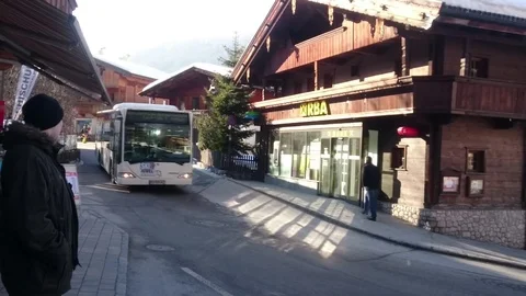 SKIBUS PICKS UP PASSENGERS IN AUSTRIA Stock Footage 121443501