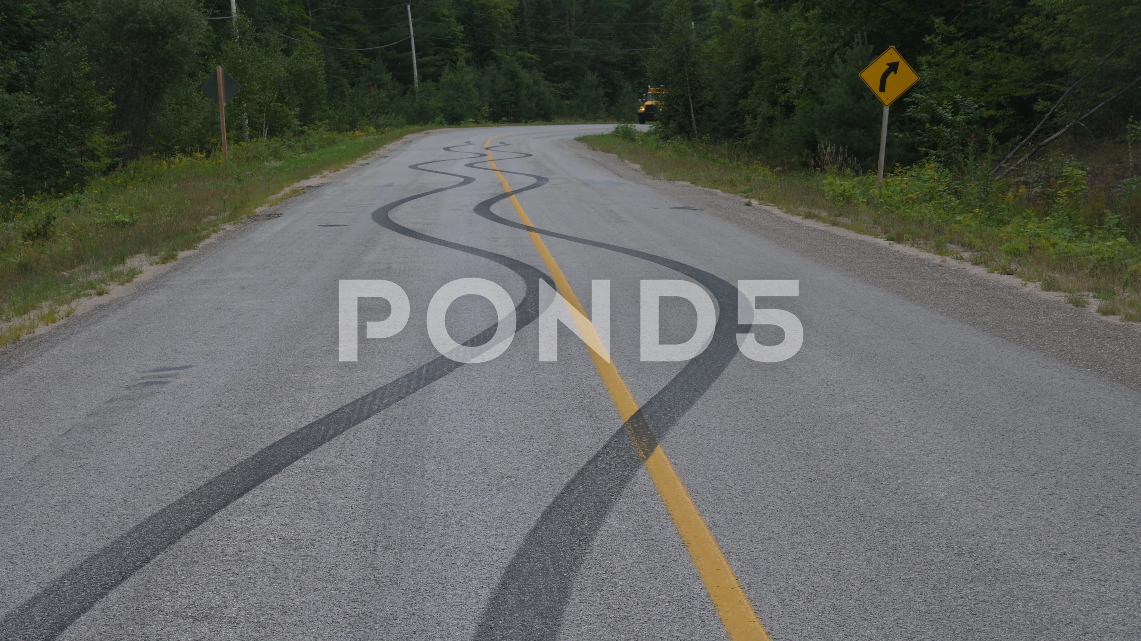 Skid marks on road from car doing a burn, Stock Video