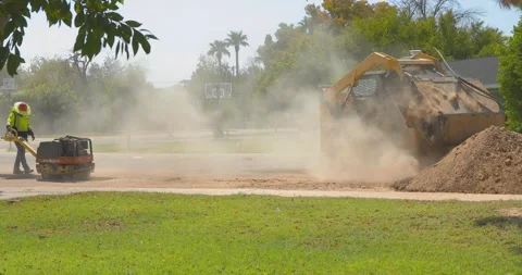 Skid Steer and Compactor Stock Footage 138788646