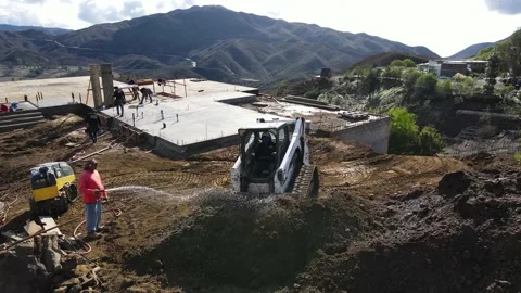Skid Steer on construction yard on a hilltop Stock-Footage 228794781