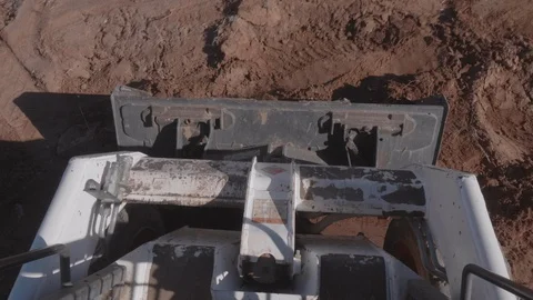 Skid Steer Scooping Dirt in Front End Loader Video stock 128343161