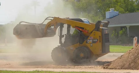 Skid Steers Unloading Sand Stock Footage 138788633