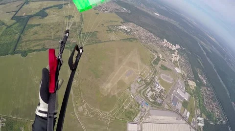 Skidiver parachuting down pov Stock Footage 68773383