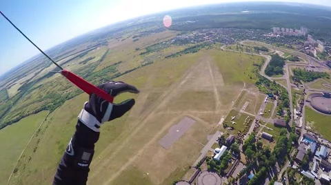 Skidiver parachuting down pov Stock Footage 68773820