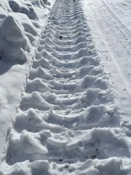 Skidmark in snow with sunlight Stock Photos