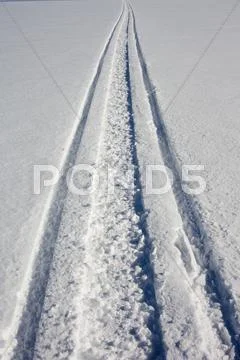 Skidoo track in fresh clean snow Stock Photos