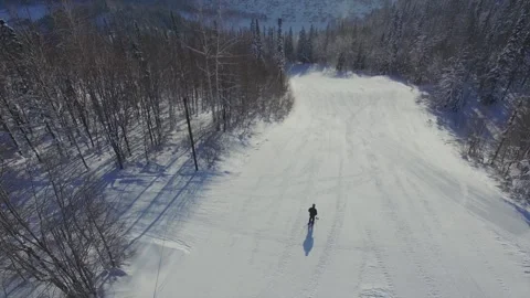 A skier and rolls down the mountain Stock-Footage 103310458