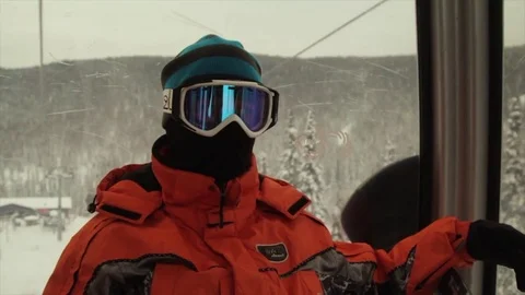 A skier ascends the mountain on the lift. Stock Footage 83121553