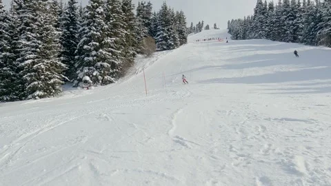 Skier athlete skiing down an alpine mount ski slope Stock Footage 271200449