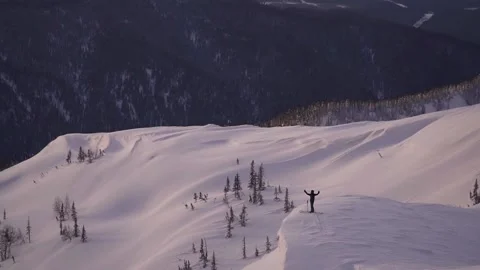 Skier on the background of the mountains at sunset Stock Footage 94408302