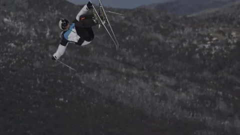 Skier in black/blue white performs jump. Stock Footage 81882397