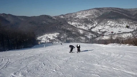 Skier Carving Down the Snowy Slopes on the Mountain With Clear Skies Snowy Trees Video stock 71651602