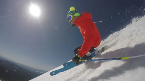 Skier carving soft snow under a hot sun Stock Footage 48372572