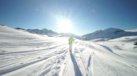 Skier on connecting path to ski piste Stock Footage 46164217