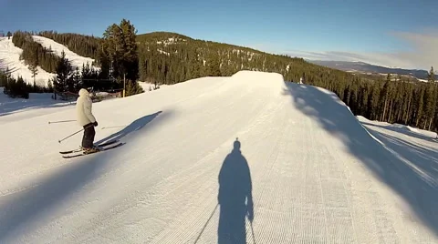 A skier does a 360 jump off a ramp at a ski resort. Stock Footage 68598752